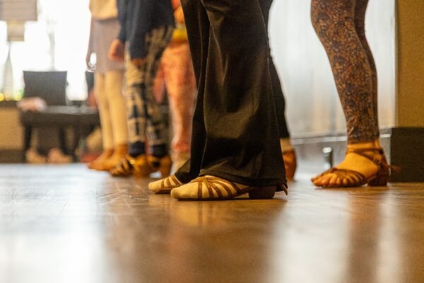 Kids aged 3 and up participating in a free trial dance class at Moonlight Ballroom Dance Studio, learning dance techniques in a bright, welcoming studio environment